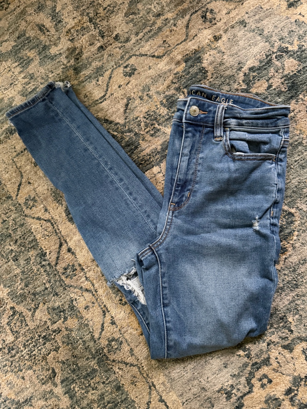 American Eagle Outfitters Medium Blue Skinny Jeans with Distressed Hem
